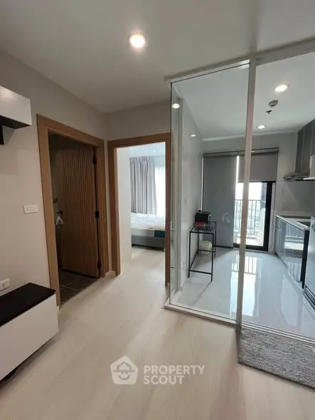 Modern apartment interior with sleek kitchen and cozy bedroom view