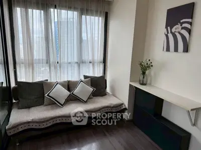 Cozy living room with stylish sofa and elegant decor, perfect for relaxation.