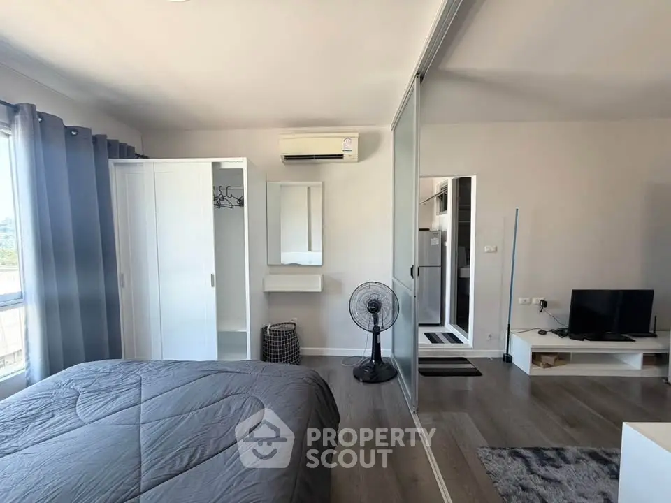 Modern bedroom with mirrored closet and air conditioning in stylish apartment