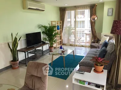 Spacious living room with modern decor and balcony access in a stylish apartment.