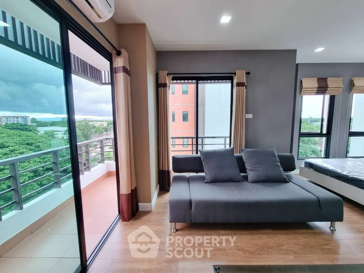 Modern living room with balcony and scenic view in contemporary apartment