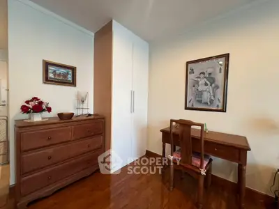 Charming study room with wooden furniture and elegant decor, perfect for a cozy home office setup.