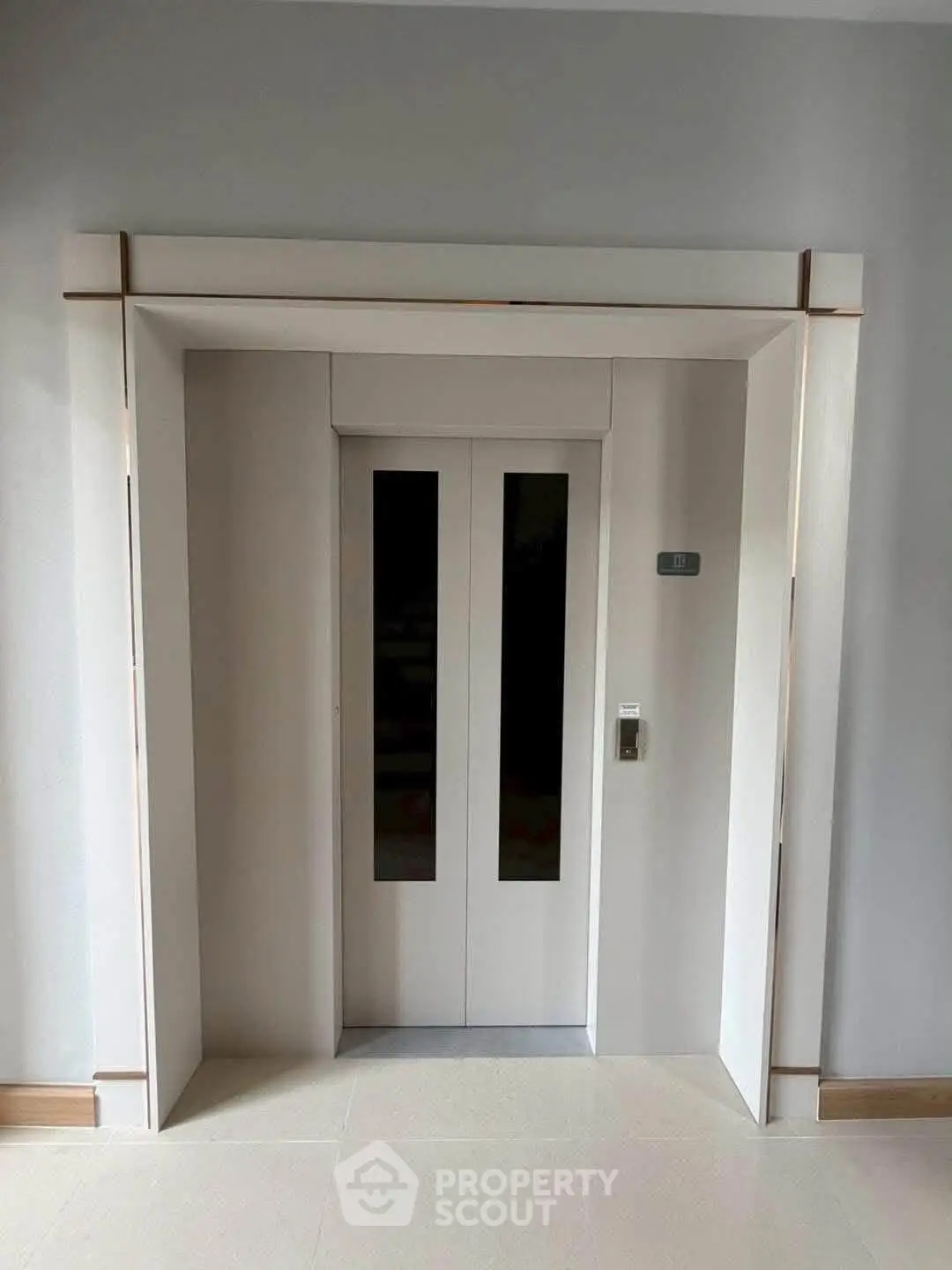 Modern elevator entrance in a residential building with sleek design