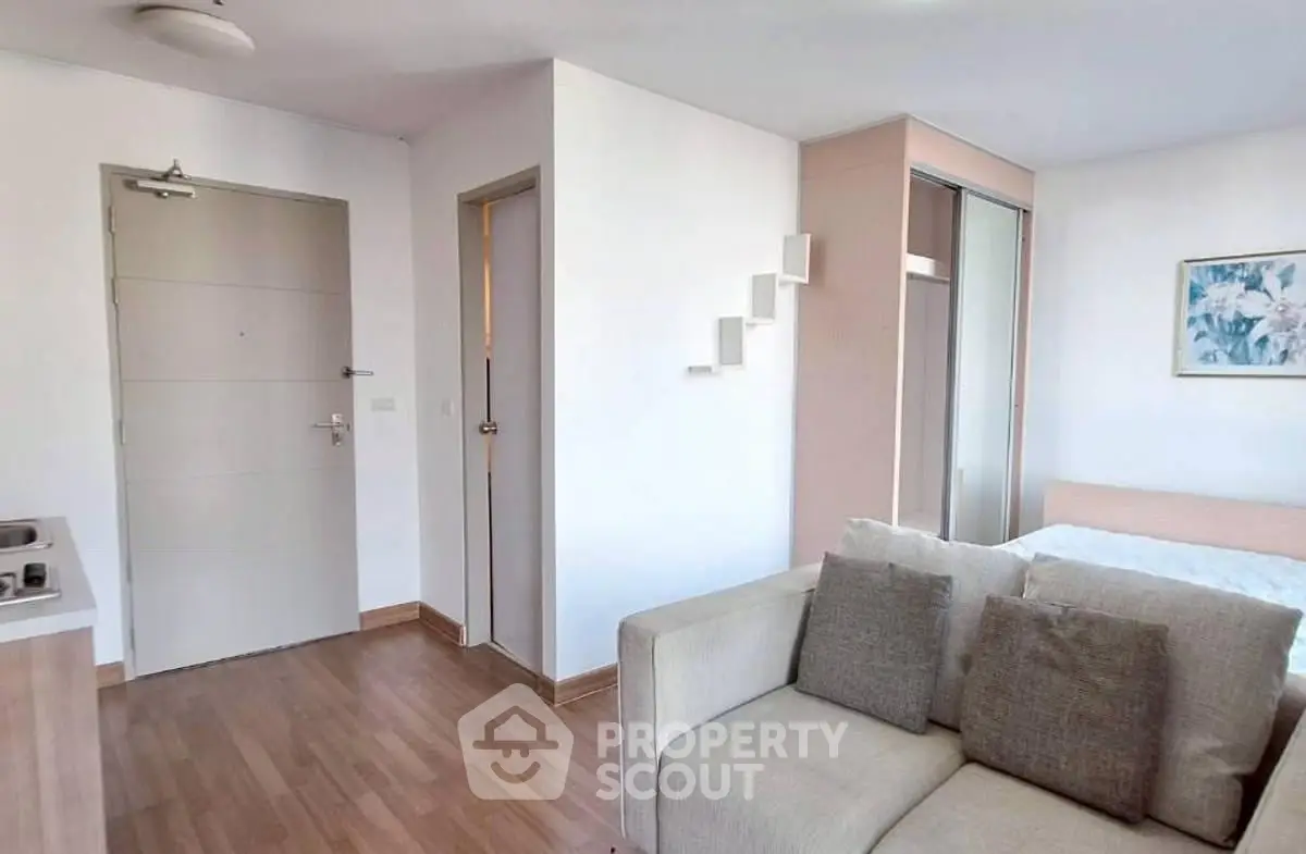 Modern studio apartment with cozy living area and stylish decor