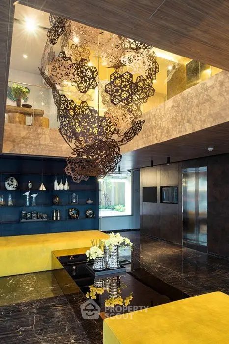 Luxurious modern living room with unique chandelier and elegant decor