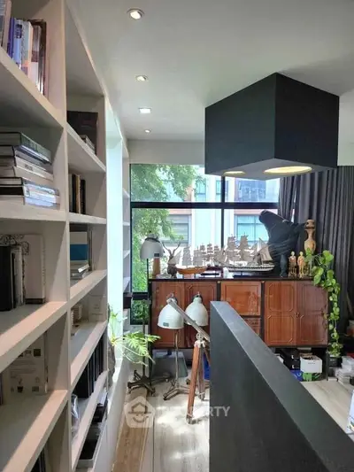 Stylish study room with modern decor and large window view