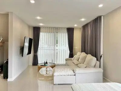 Spacious modern living room with elegant decor and natural light
