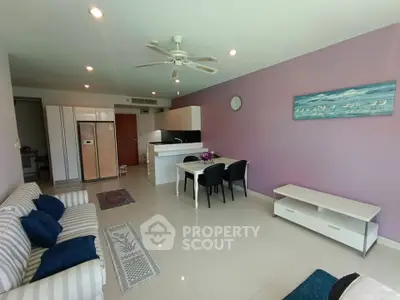 Spacious open-plan living room with modern kitchen and stylish decor