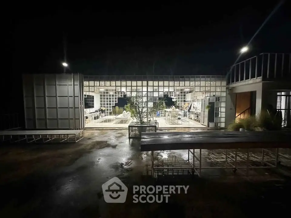 Modern architectural building with open layout and night lighting
