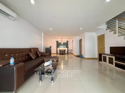 Spacious modern living room with sleek furniture and open layout