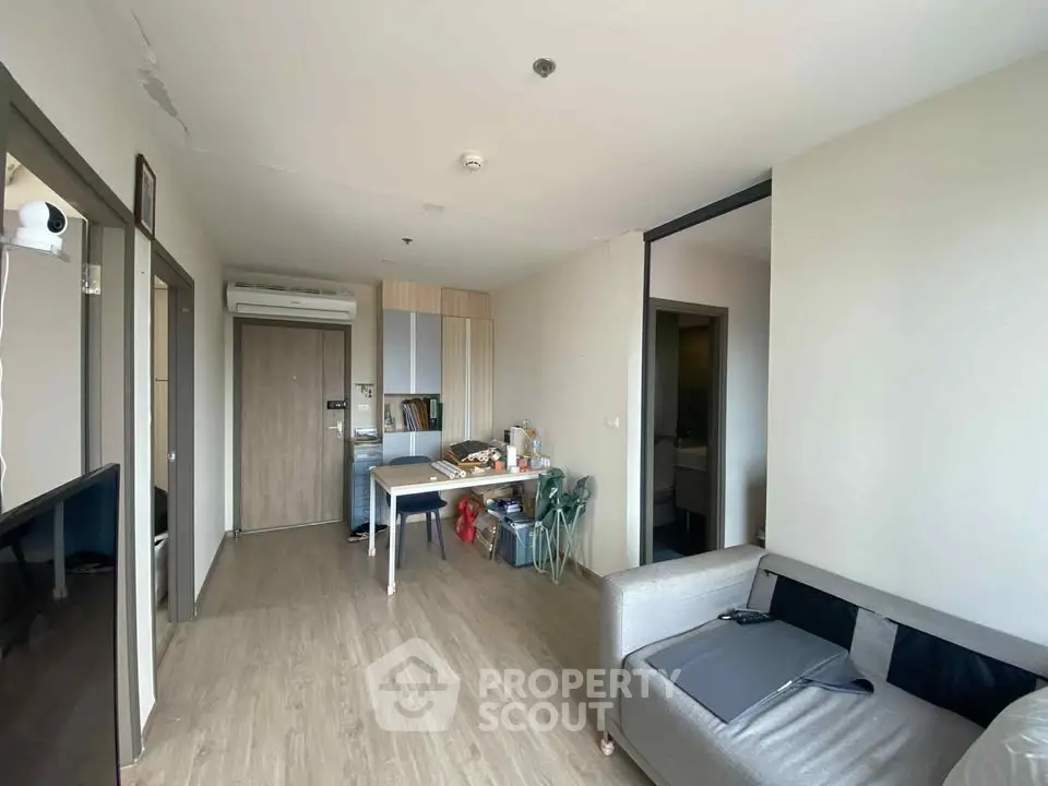 Modern living room with open layout and stylish furniture in a cozy apartment.