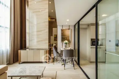 Luxurious modern living room with elegant dining area and glass partition