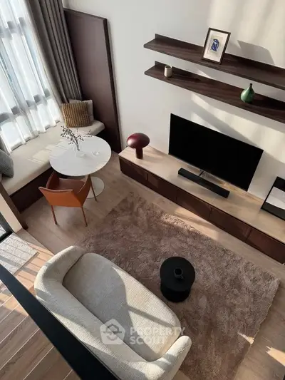 Stylish modern living room with cozy seating and elegant decor, perfect for relaxation and entertainment.