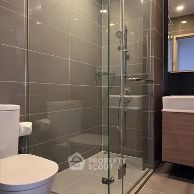 Modern bathroom with glass shower and sleek fixtures