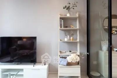 Modern living room with stylish decor and sleek TV setup