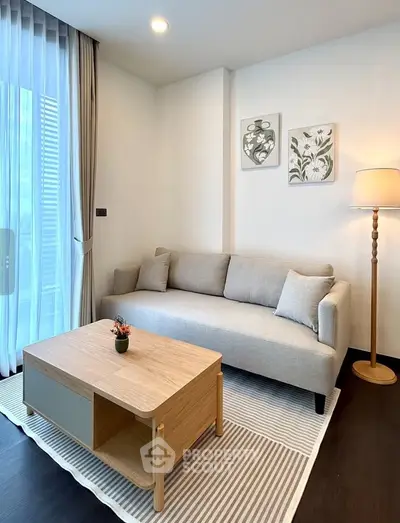 Modern living room with cozy sofa, stylish coffee table, and elegant decor in a bright, inviting space.