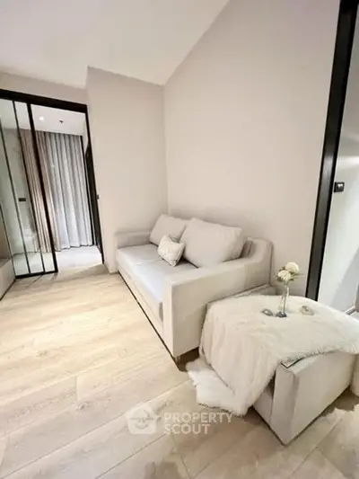 Cozy modern living room with elegant sofa and soft lighting