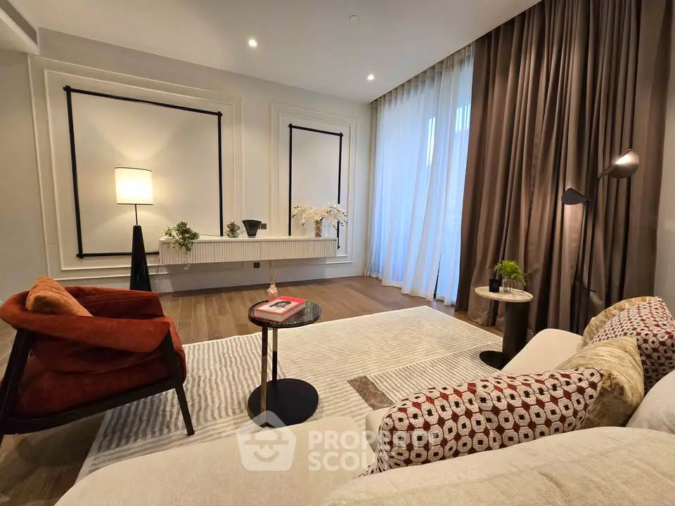 Elegant living room with modern decor and floor-to-ceiling curtains