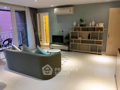 Modern living room with stylish decor and balcony access