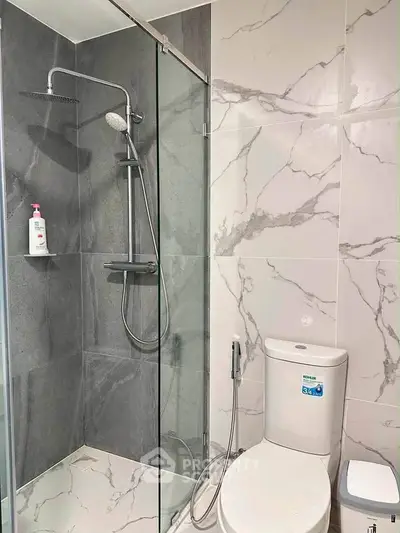 Modern bathroom with sleek shower and elegant marble tiles