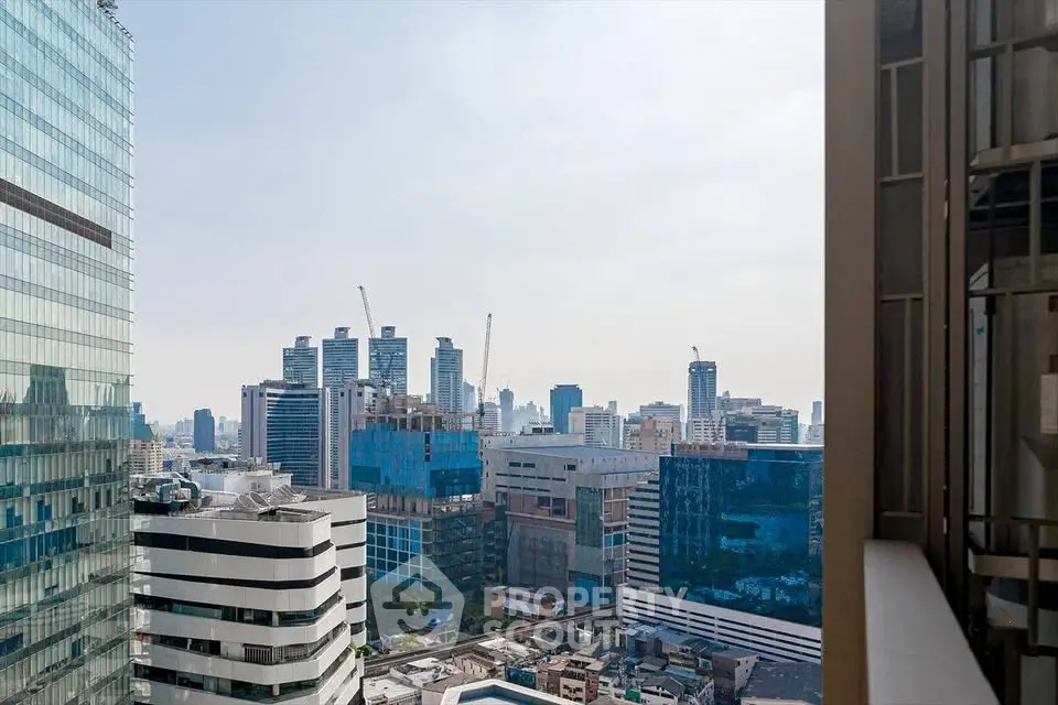 Stunning cityscape view from high-rise building showcasing urban skyline and modern architecture.