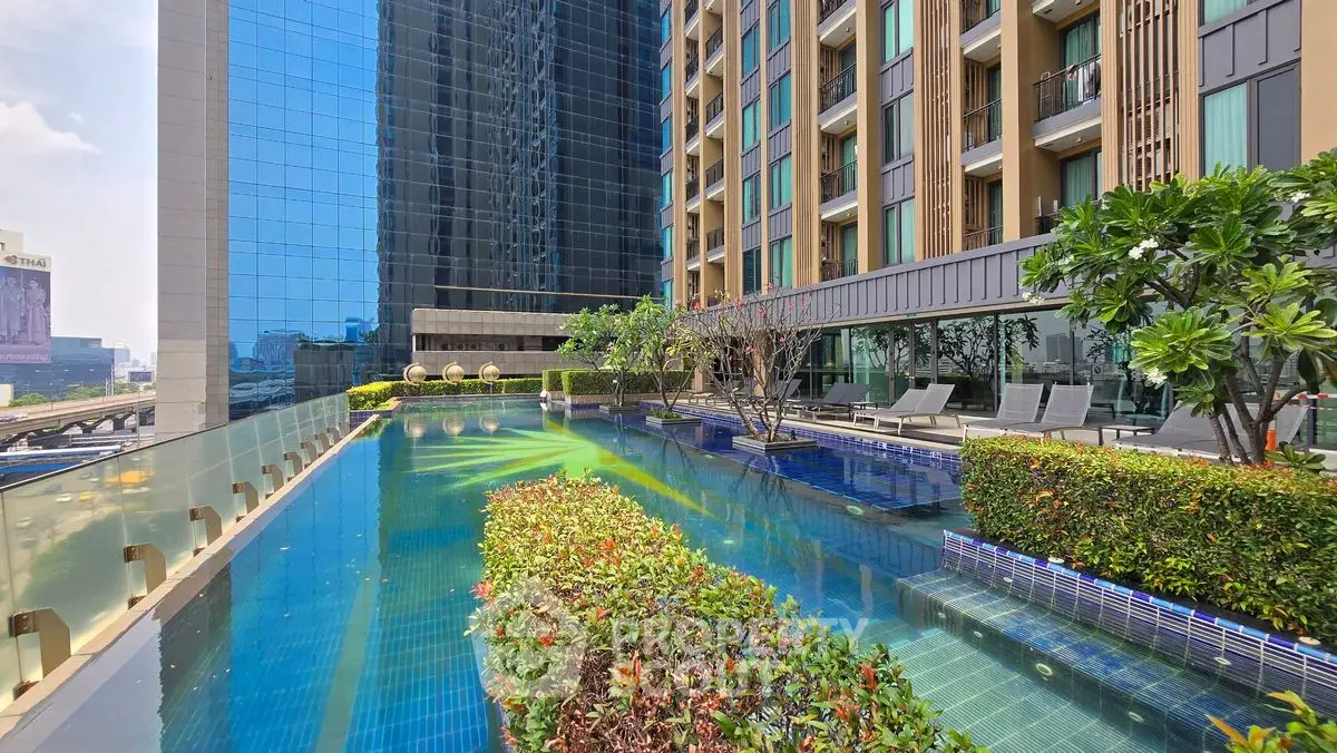 Luxurious rooftop pool with stunning city views and lush greenery