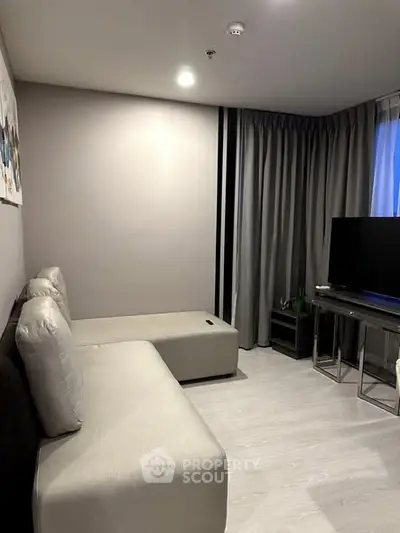 Modern living room with sleek furniture and neutral tones