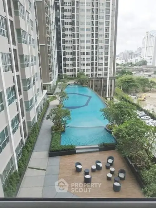Luxurious high-rise apartment with stunning pool and modern amenities.