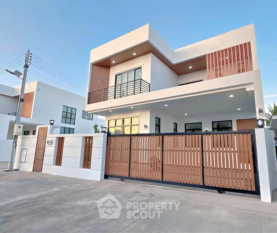Modern two-story house with sleek design and spacious driveway