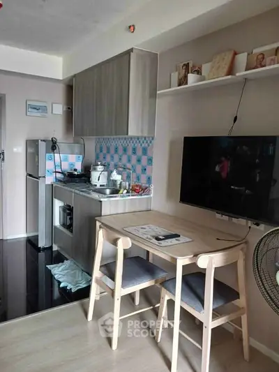 Cozy kitchen with dining area featuring modern appliances and stylish decor