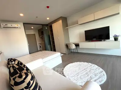 Modern living room with stylish furniture and built-in TV unit in a contemporary apartment.