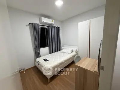 Cozy bedroom with modern furniture and air conditioning