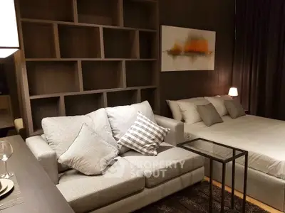 Modern studio apartment with cozy living area and stylish decor