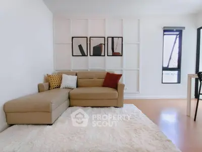 Stylish living room with modern decor and cozy sofa in a bright apartment.