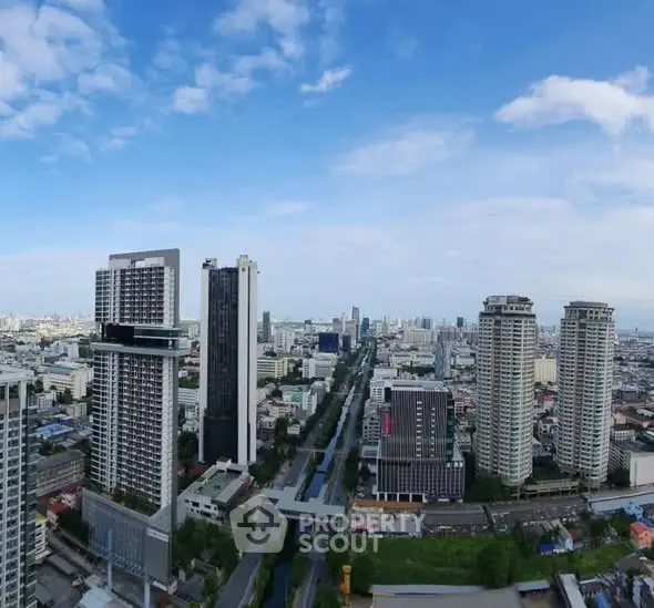 Stunning cityscape view with modern high-rise buildings under a clear blue sky.