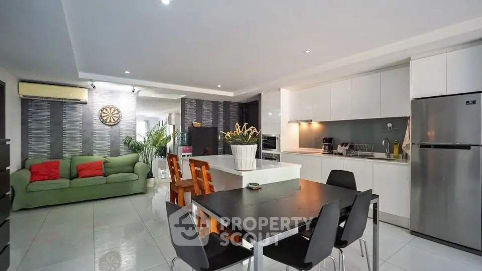 Spacious modern kitchen with open layout and stylish dining area