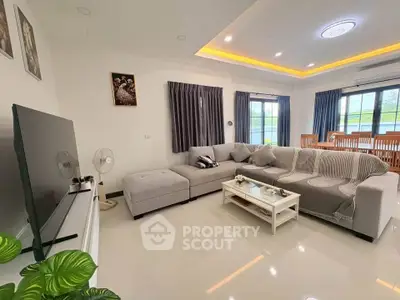 Spacious modern living room with large sectional sofa and elegant decor