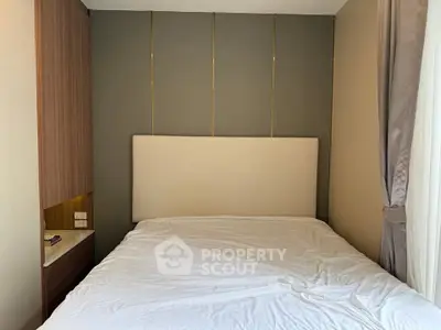 Modern bedroom with stylish headboard and elegant curtains