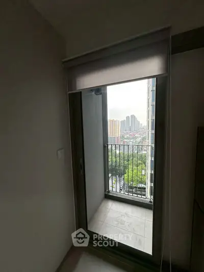 Cozy apartment balcony with city view, perfect for relaxation and enjoying the skyline.