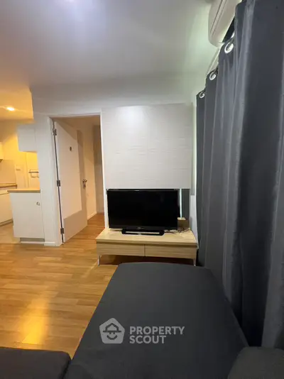 Modern living room with sleek TV setup and cozy ambiance