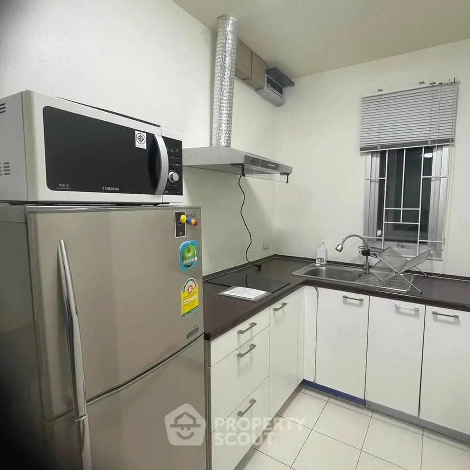 Modern kitchen with stainless steel appliances and sleek cabinetry