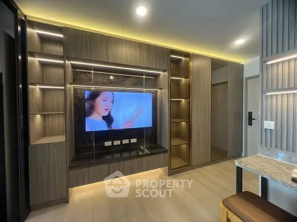 Modern living room with built-in entertainment center and ambient lighting