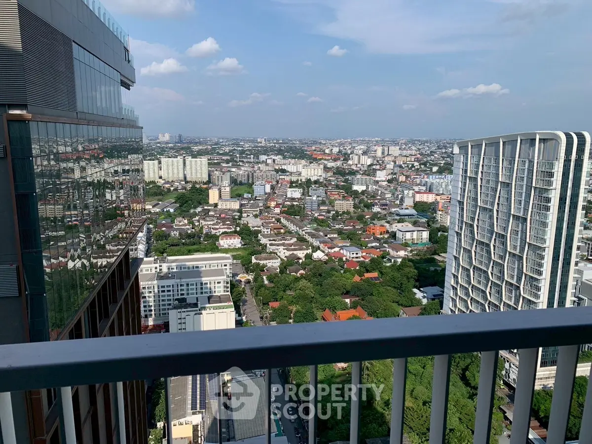 Stunning cityscape view from a high-rise balcony showcasing urban living and expansive skyline.