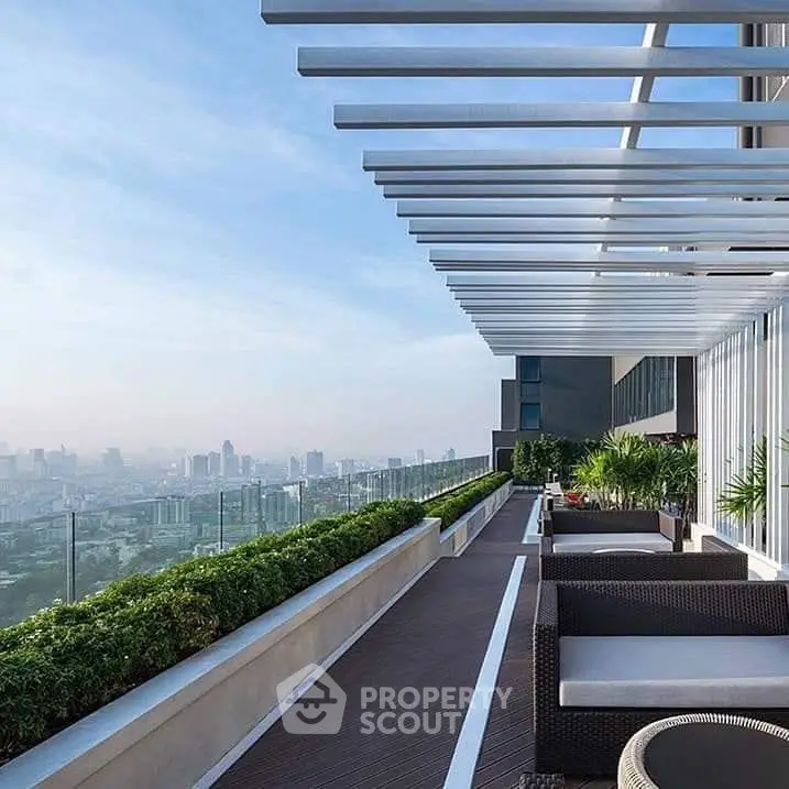 Luxurious rooftop terrace with stunning city skyline view and modern seating area.