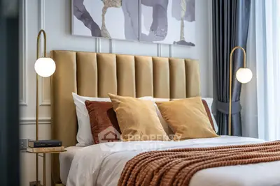Luxurious bedroom with plush headboard and elegant lighting