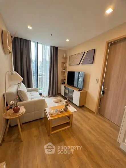 Cozy modern living room with wooden flooring and stylish decor