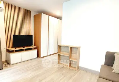 Modern living room with sleek wooden accents and ample storage space