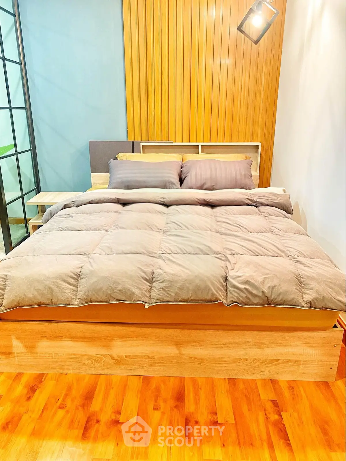Modern bedroom with stylish wooden accents and cozy bedding
