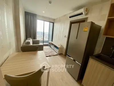 Modern living room with balcony view and stylish furniture in a cozy apartment.