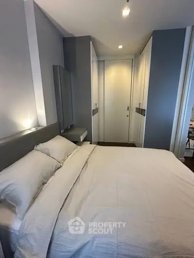 Modern bedroom with sleek design and ample storage space